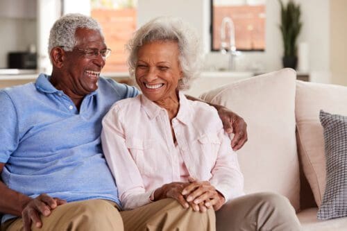 Rediscovering Romance: Love and Relationships in the Senior Years. Elderly couple is sitting on the couch together in love. | Planning Ahead